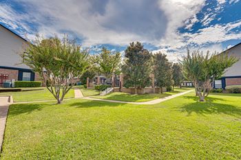 Landscaped courtyard with walking paths and trees